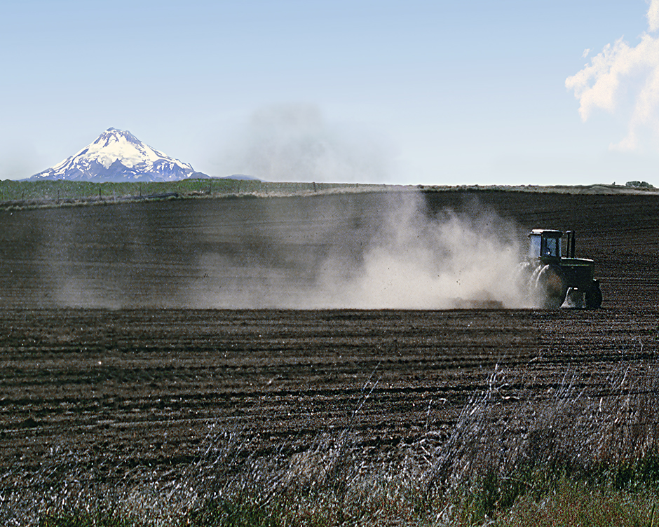 Mt Jefferson near Madras, Oregon, Tractor, disk and dust