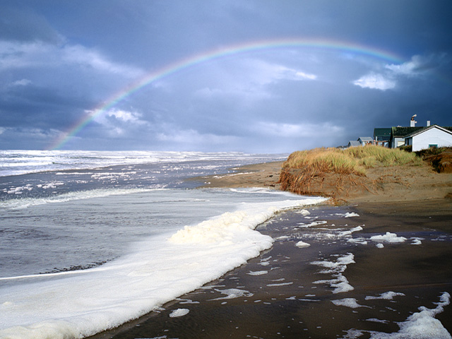 Oregon beaches picture - Rainbow over houses in Yachats