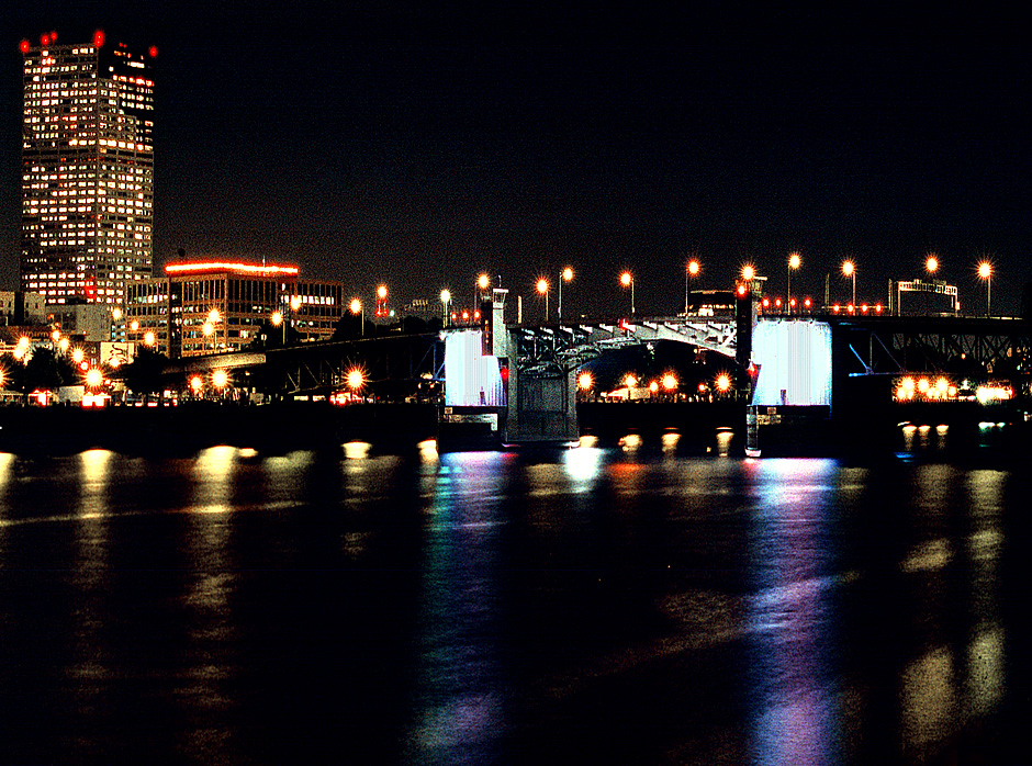 The Morrison Bridge on Willamette River; night lights; Portland, Oregon