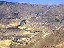 a ranch dwarfed by the huge hills of Imnaha Canyon
