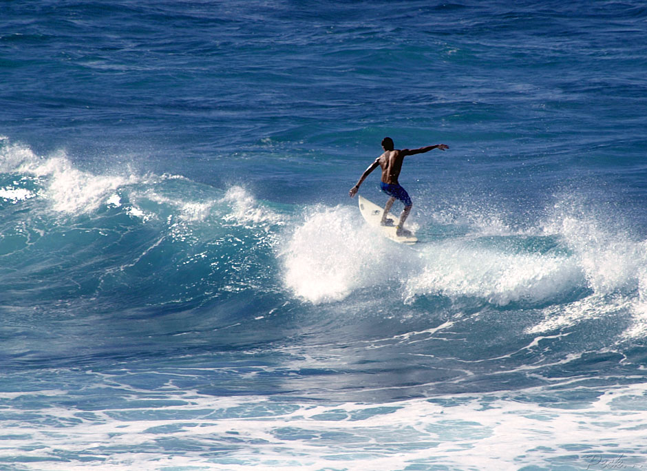 Buy this Suntan boy surfing in Maui, Hawaii picture