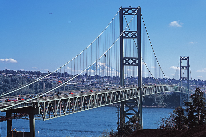 Tacoma Narrows Suspension Bridge; Mt. Rainier; planes passing from Seatack airport