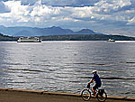 Olympic Mountains in bg; bicycle on Alki Avenue in West Seattle