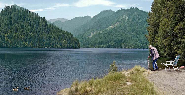 Oregon river pictures; Blue River Reservoir with Fisherwoman; panorama sold as framed photo, canvas or digital files